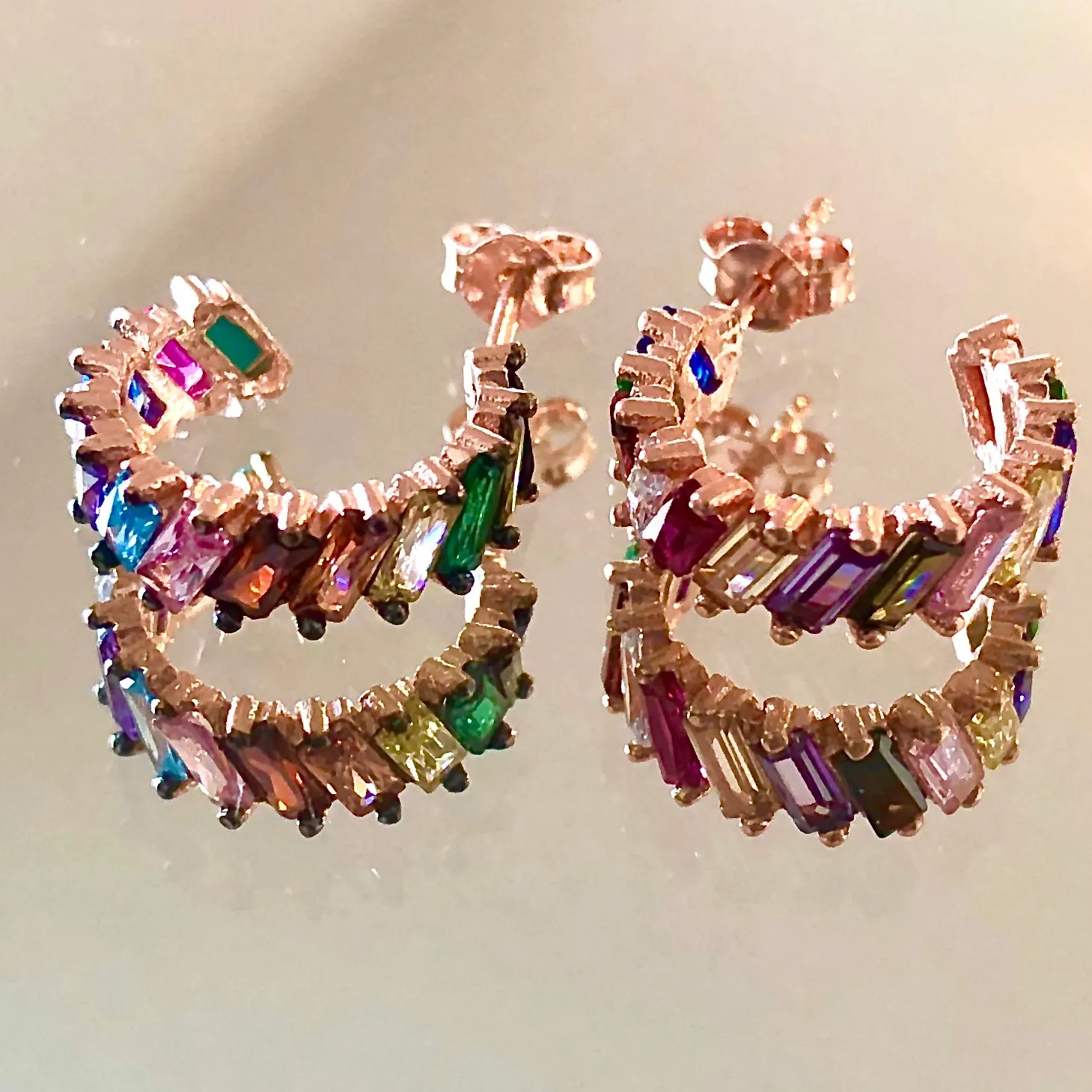 Earring with diagonal cut rainbow colored stones