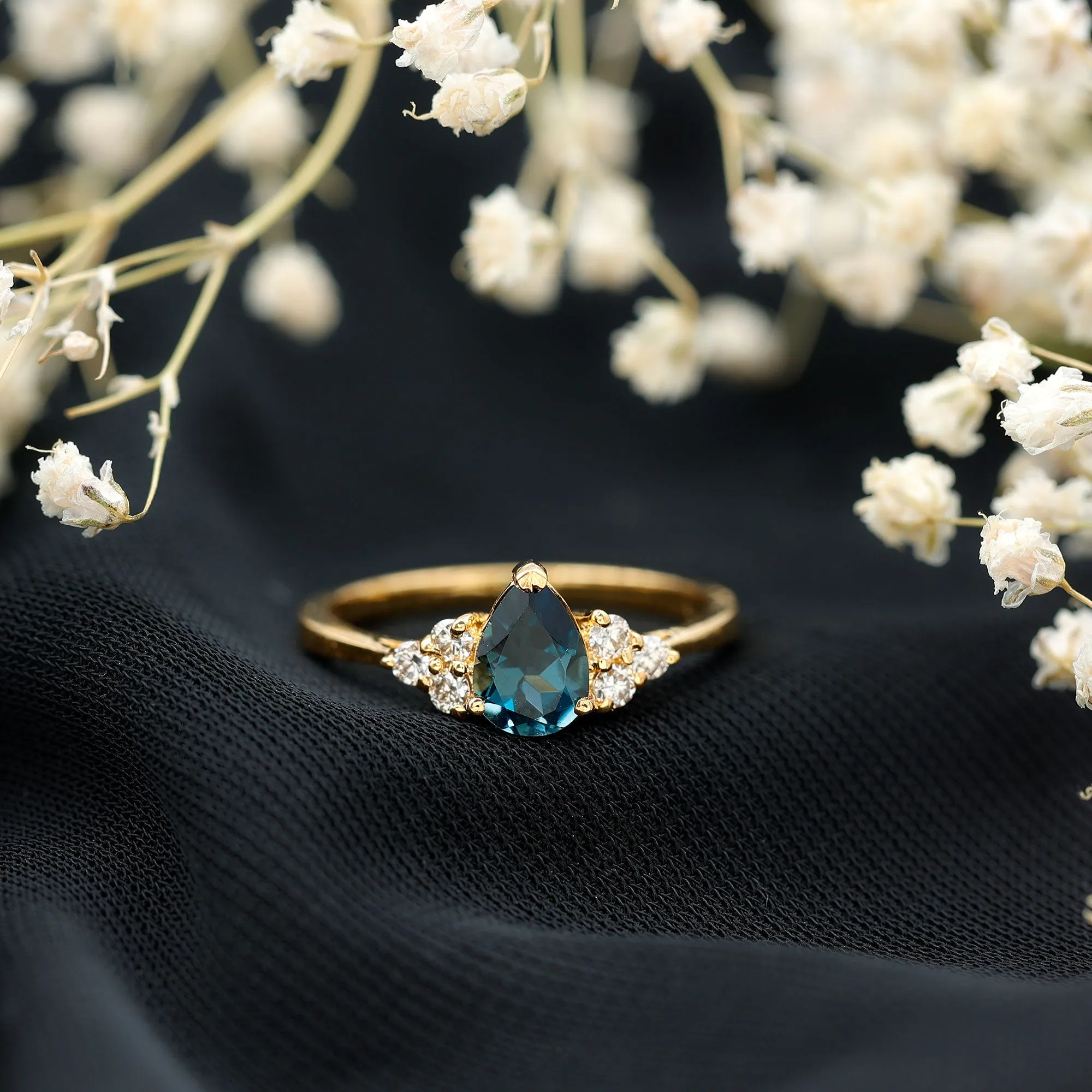 Pear Cut London Blue Topaz Engagement Ring with Diamond Trio